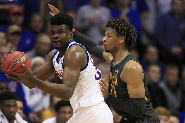 Kansas center Udoka Azubuike, left, and Baylor forward Freddie Gillespie (33) during the second half of an NCAA college basketball game in Lawrence, Kan., Saturday, Jan. 11, 2020. Baylor defeated Kansas 55-67. (AP Photo/Orlin Wagner)