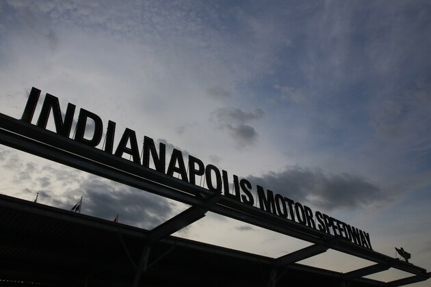 The sun begins to rise of the main entrance to the the track before Indianapolis 500 IndyCar auto race at Indianapolis Motor Speedway, Sunday, May 26, 2019, in Indianapolis. (AP Photo/R Brent Smith)