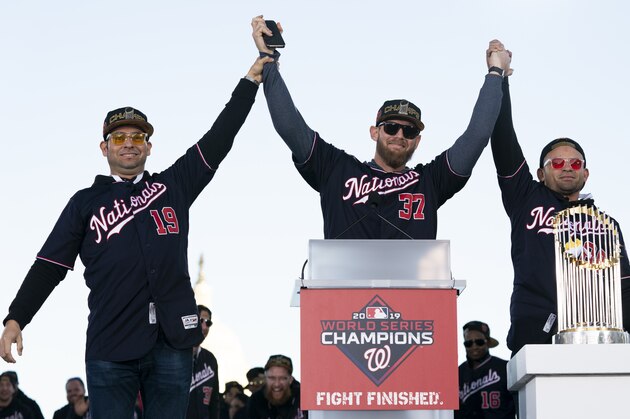 WASHINGTON, DC - NOVEMBER 02: Anibal Sanchez #19, Stephen Strasburg #37 and Gerardo Parra #88 of the Washington Nationals celebrate during a parade to celebrate the Washington Nationals World Series victory over the Houston Astros on November 2, 2019 in Washington, DC. This is the first World Series win for the Nationals in 95 years. (Photo by Patrick McDermott/Getty Images)