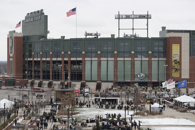 Fans tailgate outside Lambeau Field before an NFL football game between the Green Bay Packers and the Miami Dolphins Sunday, Nov. 11, 2018, in Green Bay, Wis. (AP Photo/Matt Ludtke)