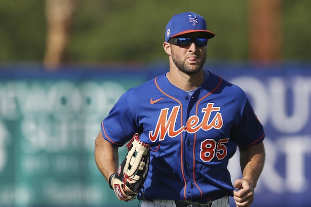 New York Mets Tim Tebow runs in from left field during a spring training baseball game against the Miami Marlins on Saturday, Feb 22, 2020, in Port St. Lucie, Fla. The Marlins won 5-3. (AP Photo/Vera Nieuwenhuis)