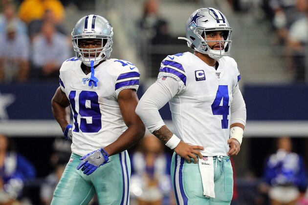 ARLINGTON, TEXAS - OCTOBER 06: Amari Cooper #19 and Dak Prescott #4 of the Dallas Cowboys stand on the field in the first quarter against the Green Bay Packers at AT&T Stadium on October 06, 2019 in Arlington, Texas. (Photo by Richard Rodriguez/Getty Images)