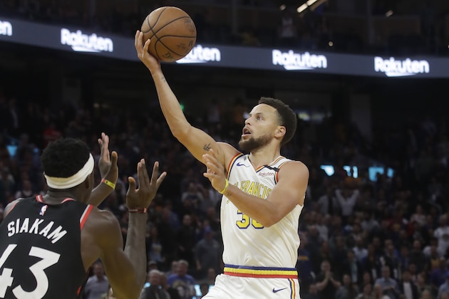 Golden State Warriors guard Stephen Curry, right, shoots against Toronto Raptors forward Pascal Siakam (43) during the second half of an NBA basketball game in San Francisco, Thursday, March 5, 2020. (AP Photo/Jeff Chiu)