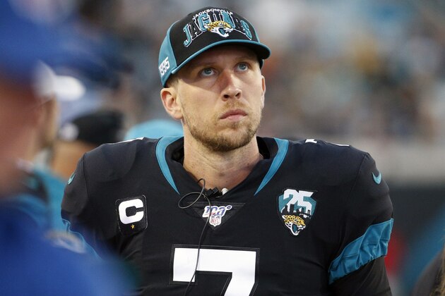 Jacksonville Jaguars quarterback Nick Foles walks along the bench area as he looks up at the scoreboard during the first half of an NFL football game against the Los Angeles Chargers, Sunday, Dec. 8, 2019, in Jacksonville, Fla. (AP Photo/Stephen B. Morton)