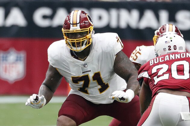 FILE - In this Sept. 9, 2018, file photo, Washington Redskins offensive tackle Trent Williams (71) is shown in action during an NFL football game against the Arizona Cardinals, in Glendale, Ariz. Fans worry that the summer rite in the NFL, training camp holdouts, won’t affect their team’s chances for a championship. This year’s crop of no-shows includes an All-Pro receiver, the Saints’ Michael Thomas; a standout offensive tackle who might be the key to the Redskins’ offense, Trent Williams; and budding stars DEs Jadeveon Clowney of the Texans, Yannick Ngakoue of the Jaguars, and RB Melvin Gordon of the Chargers. (AP Photo/Rick Scuteri, File)
