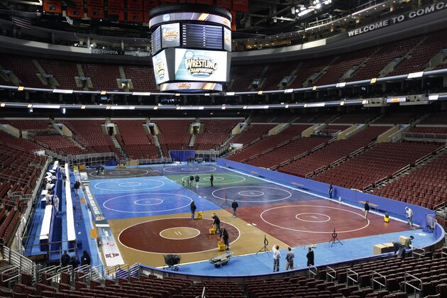 Workman prepare for the NCAA 2011 Division I Wrestling Championships at the Wells Fargo Center in Philadelphia, Tuesday, March 15, 2011. The NCAA Division I wrestling championships begin Thursday in Philadelphia, with Cornell and Penn State considered serious contenders to bring a national championship back East for the first time since 1953.   (AP Photo)