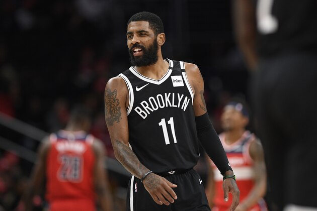 Brooklyn Nets guard Kyrie Irving (11) reacts during the first half of an NBA basketball game against the Washington Wizards, Saturday, Feb. 1, 2020, in Washington. (AP Photo/Nick Wass)