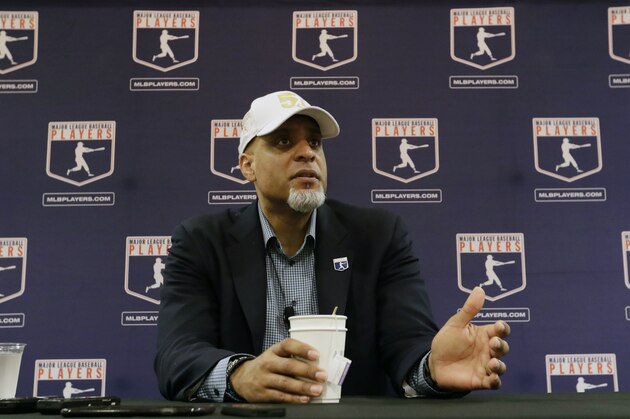 FILE - In this Feb. 19, 2017, file photo, Executive Director of the Major League Players Association, Tony Clark, answers questions at a news conference in Phoenix. Players' union head Tony Clark is guarding against drawing any conclusions about the free-agent market based on Manny Machado’s contract and says Adam Wainwright’s recent comments about a possible strike were in line with the level of concern he hears from the pitcher’s colleagues. Clark met with the Los Angeles Angels on Thursday, Feb. 21, 2019, starting his spring training tour as several top players still look for teams. (AP Photo/Morry Gash, File)