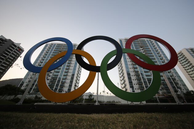 FILE - In this July 23, 2016, file photo, a representation of the Olympic rings are displayed in the Olympic Village in Rio de Janeiro, Brazil. The U.S. Olympic and Paralympic Committee will add athletes to its board and enhance its oversight of individual sports organizations. It’s part of a package of reforms stemming from the Larry Nassar sex-abuse scandal. The reforms were approved Thursday, Nov. 8, 2019 and go into effect in January. (AP Photo/Leo Correa, File)