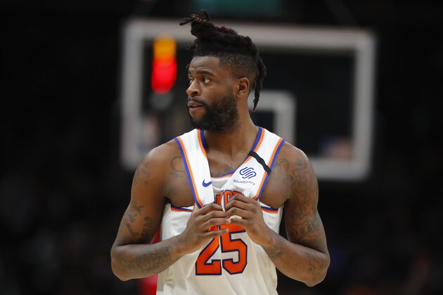 New York Knicks guard Reggie Bullock (25) looks back to the bench during a break in play in the first half of an NBA basketball game against the Atlanta Hawks on Sunday, Feb. 9, 2020, in Atlanta. (AP Photo/Todd Kirkland)