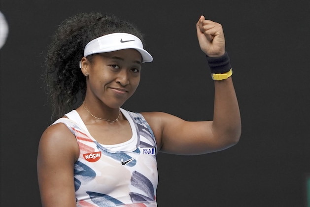 Japan's Naomi Osaka celebrates after defeating Marie Bouzkova of the Czech Republic in their first round singles match the Australian Open tennis championship in Melbourne, Australia, Monday, Jan. 20, 2020. (AP Photo/Lee Jin-man)
