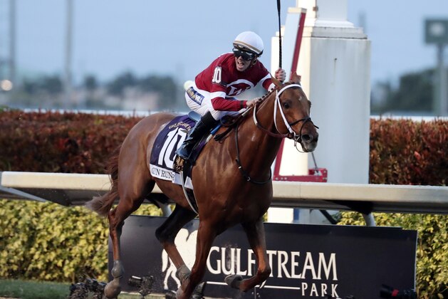 Jockey Florent Geroux celebrates as Gun Runner crosses the finish line to win the Pegasus World Cup Invitational horse race, Saturday, Jan. 27, 2018, at Gulfstream Park in Hallandale Beach, Fla. (AP Photo/Lynne Sladky) Jockey Florent Geroux celebrates as Gun Runner crosses the finish line to win the Pegasus World Cup Invitational horse race, Saturday, Jan. 27, 2018, at Gulfstream Park in Hallandale Beach, Fla. (AP Photo/Lynne Sladky)