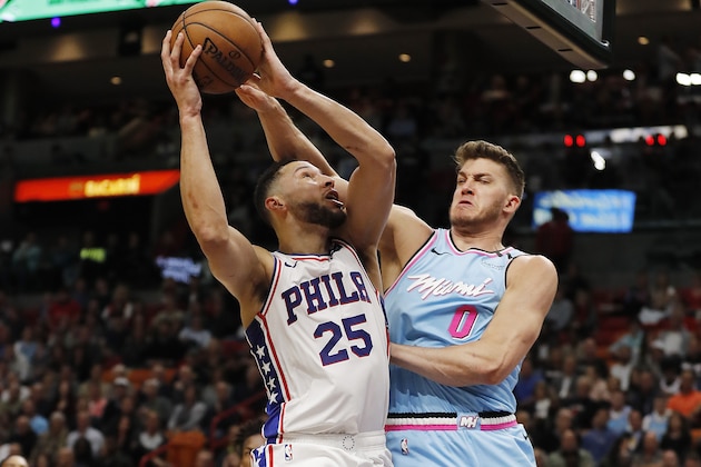 MIAMI, FLORIDA - FEBRUARY 03:  Ben Simmons #25 of the Philadelphia 76ers shoots against Meyers Leonard #0 of the Miami Heat during the first half at American Airlines Arena on February 03, 2020 in Miami, Florida. NOTE TO USER: User expressly acknowledges and agrees that, by downloading and/or using this photograph, user is consenting to the terms and conditions of the Getty Images License Agreement.  (Photo by Michael Reaves/Getty Images)