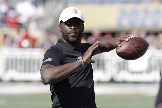 Former NFL quarterback Michael Vick throws the football before the NFL Pro Bowl football game, Sunday, Jan. 26, 2020, in Orlando, Fla. (AP Photo/Chris O?Meara)