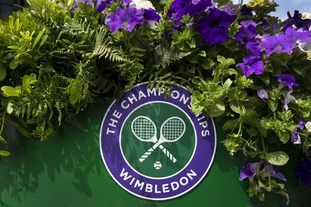 LONDON, ENGLAND - JULY 10: The Wimbledon logo amongst flowers during Day Nine of The Championships - Wimbledon 2019 at All England Lawn Tennis and Croquet Club on July 10, 2019 in London, England. (Photo by Visionhaus/Getty Images)