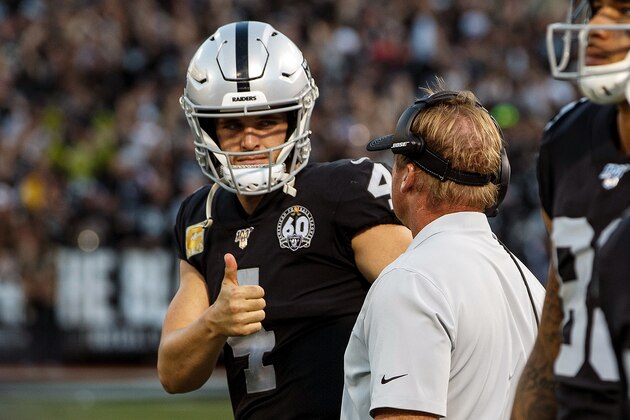 OAKLAND, CA - NOVEMBER 17: Quarterback Derek Carr #4 of the Oakland Raiders talks to head coach Jon Gruden on the sidelines during the fourth quarter against the Cincinnati Bengals at RingCentral Coliseum on November 17, 2019 in Oakland, California. The Oakland Raiders defeated the Cincinnati Bengals 17-10. (Photo by Jason O. Watson/Getty Images)