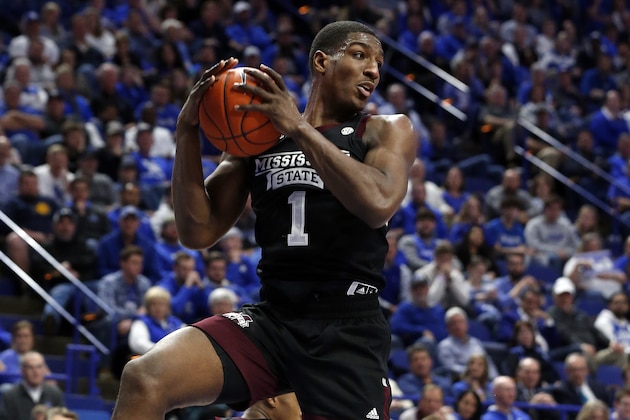 Mississippi State's Reggie Perry pulls down a rebound during the second half of the team's NCAA college basketball game against Kentucky in Lexington, Ky., Tuesday, Feb. 4, 2020. Kentucky won 80-72. (AP Photo/James Crisp)