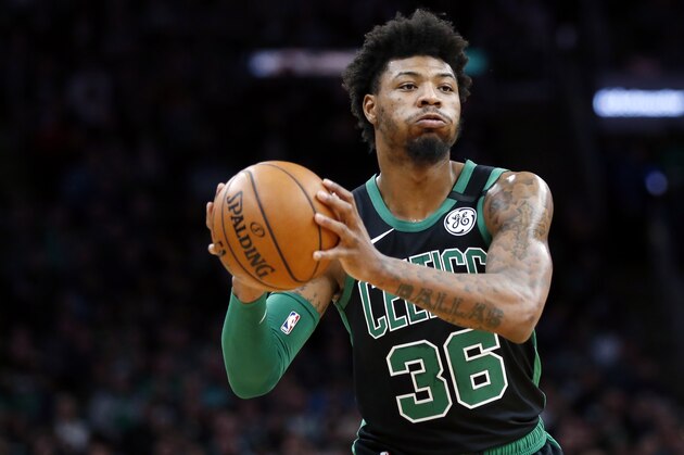 Boston Celtics' Marcus Smart plays against against the Oklahoma City Thunder during an NBA basketball game, Sunday, March, 8, 2020, in Boston. (AP Photo/Michael Dwyer) Boston Celtics' Marcus Smart plays against against the Oklahoma City Thunder during an NBA basketball game, Sunday, March, 8, 2020, in Boston. (AP Photo/Michael Dwyer)