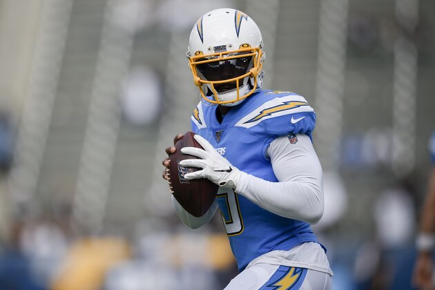 Los Angeles Chargers quarterback Tyrod Taylor warms up before an NFL football game against the Oakland Raiders in Carson, Calif., Sunday, Dec. 22, 2019. (AP Photo/Kelvin Kuo)