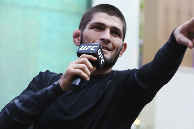 Russian UFC fighter Khabib Nurmagomedov gestures to the crowd during an open training session at Yas Mall in Abu Dhabi, United Arab Emirates, Wednesday, Sept. 4, 2019. Fighters Dustin Poirier and Khabib Nurmagomedov will face each other in UFC 242, which will be held Saturday, Sept. 7, 2019, in Abu Dhabi. Nurmagomedov did not spar during the open training, saying he was still trying to make weight for the bout. (AP Photo/Jon Gambrell)