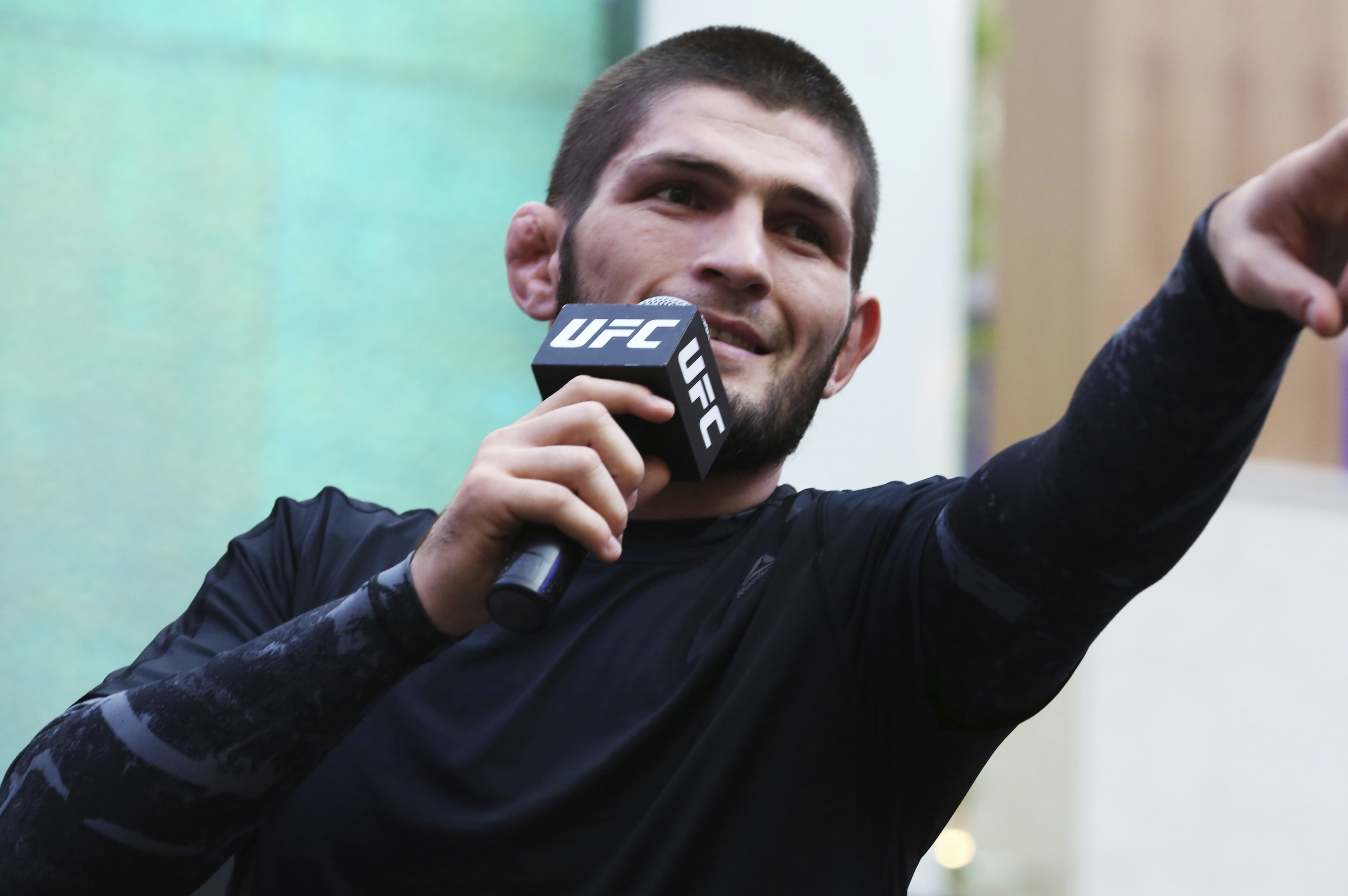 Russian UFC fighter Khabib Nurmagomedov gestures to the crowd during an open training session at Yas Mall in Abu Dhabi, United Arab Emirates, Wednesday, Sept. 4, 2019. Fighters Dustin Poirier and Khabib Nurmagomedov will face each other in UFC 242, which will be held Saturday, Sept. 7, 2019, in Abu Dhabi. Nurmagomedov did not spar during the open training, saying he was still trying to make weight for the bout. (AP Photo/Jon Gambrell)