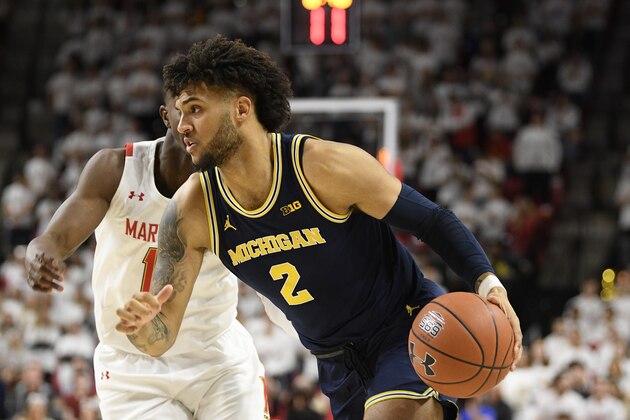 Michigan forward Isaiah Livers (2) dribbles the ball against Maryland guard Darryl Morsell, back, during the first half of an NCAA college basketball game, Sunday, March 8, 2020, in College Park, Md. (AP Photo/Nick Wass) Michigan forward Isaiah Livers (2) dribbles the ball against Maryland guard Darryl Morsell, back, during the first half of an NCAA college basketball game, Sunday, March 8, 2020, in College Park, Md. (AP Photo/Nick Wass)