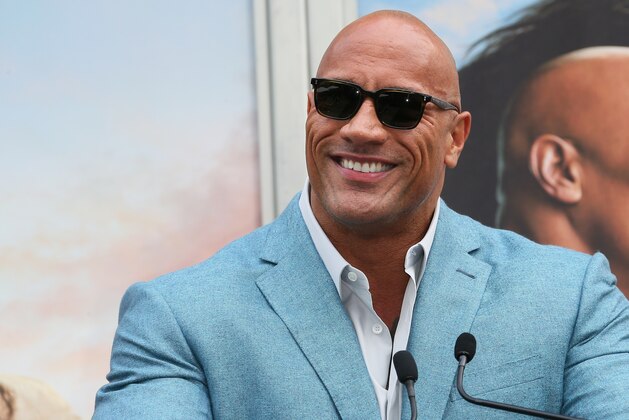 HOLLYWOOD, CALIFORNIA - DECEMBER 10: Dwayne Johnson attends a Hand and Footprint ceremony honoring Kevin Hart at the TCL Chinese Theatre IMAX on December 10, 2019 in Hollywood, California. (Photo by Jean Baptiste Lacroix/Getty Images)