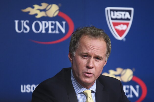 Patrick McEnroe announces his resignation as the U.S. Tennis Association's general manager of player development, at a news conference at the U.S. Open, Wednesday, Sept. 3, 2014, in New York. The change comes during a tournament in which no American men reached the round of 16 for the second year in a row - something that, until 2013, had never happened at an event that began in 1881. (AP Photo/John Minchillo)