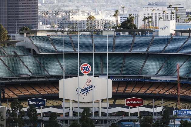 LOS ANGELES, CALIFORNIA - MARCH 26:  Dodger Stadium is viewed on what was supposed to be Major League Baseball's opening day, now postponed due to the coronavirus, on March 26, 2020 in Los Angeles, California. The Los Angeles Dodgers were slated to play against the San Francisco Giants at the stadium today. Major League Baseball Commissioner Rob Manfred is not optimistic that the league will play a full 162 game regular season due to the spread of COVID-19. (Photo by Mario Tama/Getty Images)