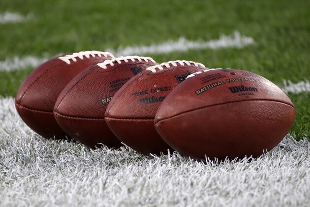 NFL Wilson footballs sit on the field during warmups before an NFL football game between the Pittsburgh Steelers and the Cincinnati Bengals at Heinz Field in Pittsburgh, Monday, Sept. 30, 2019. (AP Photo/Don Wright)