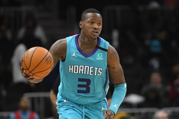 Charlotte Hornets guard Terry Rozier (3) brings the ball up the floor during an NBA basketball game against the Atlanta Hawks, Monday, March 9, 2020, in Atlanta. (AP Photo/John Amis)
