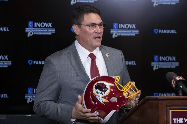 Washington Redskins new head coach Ron Rivera holds up a helmet during a news conference at the team's NFL football training facility, Thursday, Jan. 2, 2020 in Ashburn, Va. (AP Photo/Alex Brandon)