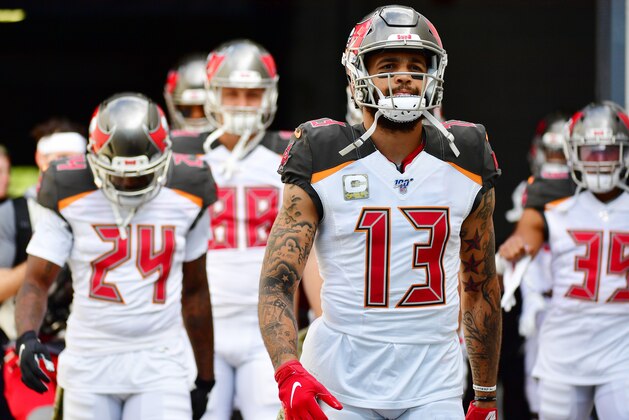 JACKSONVILLE, FLORIDA - DECEMBER 01: Mike Evans #13 of the Tampa Bay Buccaneers leads the way out to warmup before a football game against the Jacksonville Jaguars at TIAA Bank Field on December 01, 2019 in Jacksonville, Florida. (Photo by Julio Aguilar/Getty Images)