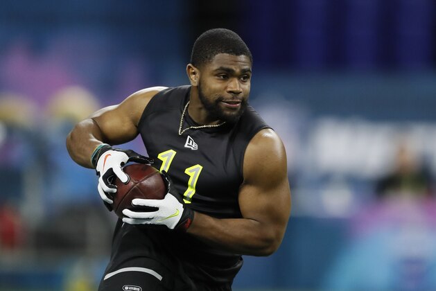 LSU running back Clyde Edwards-Helaire runs a drill at the NFL football scouting combine in Indianapolis, Friday, Feb. 28, 2020. (AP Photo/Charlie Neibergall)
