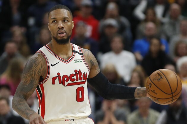 Portland Trail Blazers guard Damian Lillard (0) brings the ball up court in the first half during an NBA basketball game against the Utah Jazz Friday, Feb. 7, 2020, in Salt Lake City. (AP Photo/Rick Bowmer) Portland Trail Blazers guard Damian Lillard (0) brings the ball up court in the first half during an NBA basketball game against the Utah Jazz Friday, Feb. 7, 2020, in Salt Lake City. (AP Photo/Rick Bowmer)