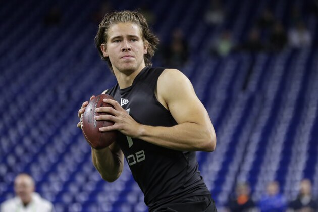 Oregon quarterback Justin Herbert runs a drill at the NFL football scouting combine in Indianapolis, Thursday, Feb. 27, 2020. (AP Photo/Michael Conroy)
