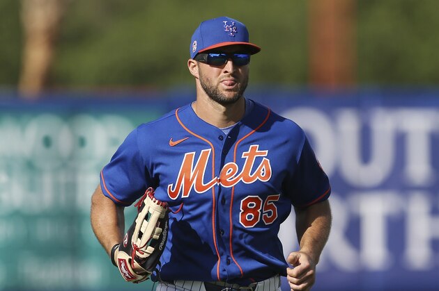New York Mets Tim Tebow runs in from left field during a spring training baseball game against the Miami Marlins on Saturday, Feb 22, 2020, in Port St. Lucie, Fla. The Marlins won 5-3. (AP Photo/Vera Nieuwenhuis)