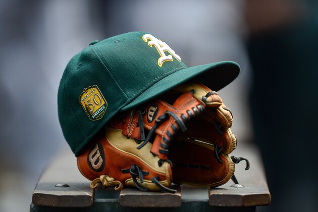 DENVER, CO - JULY 29:  An Oakland Athletics player's hat and glove rests in the dugout during interleague play between the Colorado Rockies and the Oakland Athletics at Coors Field on July 29, 2018 in Denver, Colorado.  (Photo by Dustin Bradford/Getty Images)