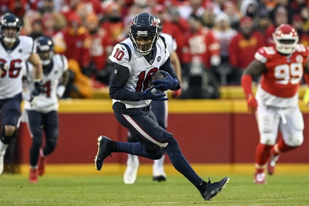 FILE - In this Jan. 12, 2020, file photo, Houston Texans wide receiver DeAndre Hopkins (10) runs against the Kansas City Chiefs during the second half of an NFL football game in Kansas City, Mo. The Arizona Cardinals have acquired three-time All-Pro receiver DeAndre Hopkins in a trade that will send running back David Johnson and draft picks to the Houston Texans, a person familiar with the situation told The Associated Press. The person spoke to the AP on condition of anonymity Monday, March 16, 2020, because the trade hasn't been officially announced.  (AP Photo/Reed Hoffmann, File)