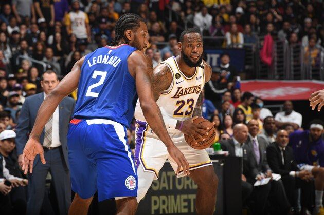 LOS ANGELES, CA - MARCH 8: Kawhi Leonard #2 of the LA Clippers plays defense against LeBron James #23 of the Los Angeles Lakers on March 8, 2020 at STAPLES Center in Los Angeles, California. NOTE TO USER: User expressly acknowledges and agrees that, by downloading and/or using this Photograph, user is consenting to the terms and conditions of the Getty Images License Agreement. Mandatory Copyright Notice: Copyright 2020 NBAE (Photo by Andrew D. Bernstein/NBAE via Getty Images)