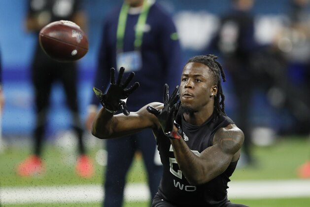 Alabama wide receiver Jerry Jeudy runs a drill at the NFL football scouting combine in Indianapolis, Thursday, Feb. 27, 2020. (AP Photo/Charlie Neibergall)