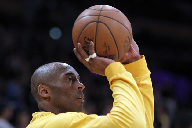 Los Angeles Lakers forward Kobe Bryant warms up before an NBA basketball game against the San Antonio Spurs in Los Angeles, Friday, Feb. 19, 2016. (AP Photo/Alex Gallardo)