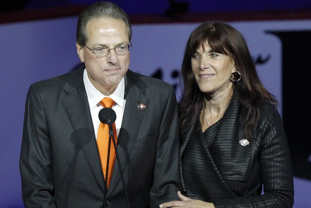 Anaheim Ducks owners Henry Samueli and his wife, Susan Samueli, speak during a ceremony for former Ducks player, Teemu Selanne, to retire his No. 8 jersey before an NHL hockey game against the Winnipeg Jets in Anaheim, Calif., Sunday, Jan. 11, 2015. (AP Photo/Alex Gallardo)