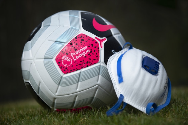 MANCHESTER, ENGLAND - APRIL 03: The official Nike Premier League match ball with a protective mask. The Coronavirus (COVID-19) pandemic has spread to many countries across the world, claiming over 40,000 lives and infecting hundreds of thousands more. on April 3, 2020 in Manchester, England (Photo by Visionhaus) MANCHESTER, ENGLAND - APRIL 03: The official Nike Premier League match ball with a protective mask. The Coronavirus (COVID-19) pandemic has spread to many countries across the world, claiming over 40,000 lives and infecting hundreds of thousands more. on April 3, 2020 in Manchester, England (Photo by Visionhaus)