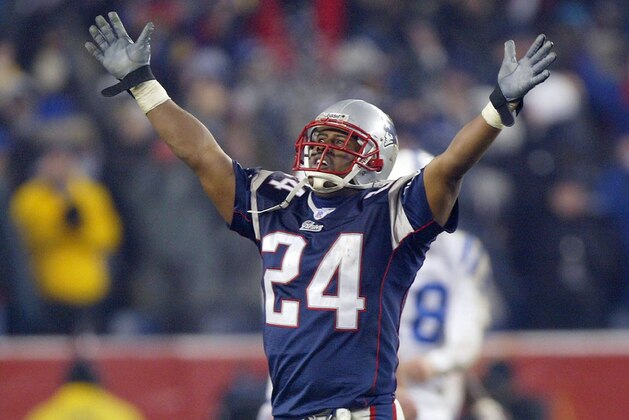FOXBORO, MA - JANUARY 18:  Cornerback Ty Law #24 of the New England Patriots celebrates against the Indianapolis Colts in the AFC Championship Game on January 18, 2004 at Gillette Stadium in Foxboro, Massachusetts. The Patriots defeated the Colts 24-14 to advance to the Super Bowl.  (Photo by Ezra Shaw/Getty Images)