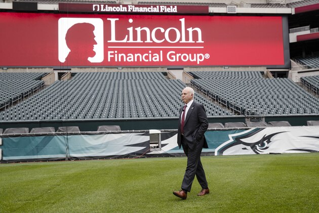 Philadelphia Eagles owner Jeffrey Lurie walks on the field to a news conference in Philadelphia, Thursday, May 9, 2019. Lincoln Financial Group and the Philadelphia Eagles announced today that they have agreed to extend the stadium naming rights for Lincoln Financial Field through the 2032 NFL season. (AP Photo/Matt Rourke)