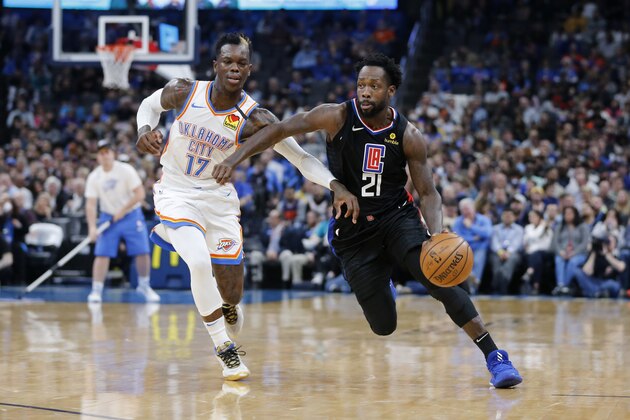 Los Angeles Clippers' Patrick Beverley (21) drives the ball against Oklahoma City Thunder's Dennis Schroder (17) during the first half of an NBA basketball game in Oklahoma City, Tuesday, March, 3, 2020. (AP Photo/Garett Fisbeck)
