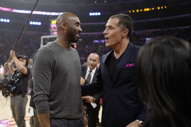 Former Los Angeles Lakers Kobe Bryant talks with Rob Pelinka during an NBA basketball game between Los Angeles Lakers and Atlanta Hawks, Sunday, Nov. 17, 2019, in Los Angeles. The Lakers won 122-101. (AP Photo/Ringo H.W. Chiu) Former Los Angeles Lakers Kobe Bryant talks with Rob Pelinka during an NBA basketball game between Los Angeles Lakers and Atlanta Hawks, Sunday, Nov. 17, 2019, in Los Angeles. The Lakers won 122-101. (AP Photo/Ringo H.W. Chiu)