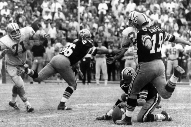 FILE - In this Nov. 8, 1970 file photo, New Orleans Saints' Tom Dempsey (19) who is missing a hand and part of his right foot, moves up to kick a 63-yard field goal in New Orleans.  The Saints of the late 1960s and '70s didn't win a lot. Give them credit, though: They sure jazzed up the NFL long before reaching the Super Bowl.  (AP Photo/File)