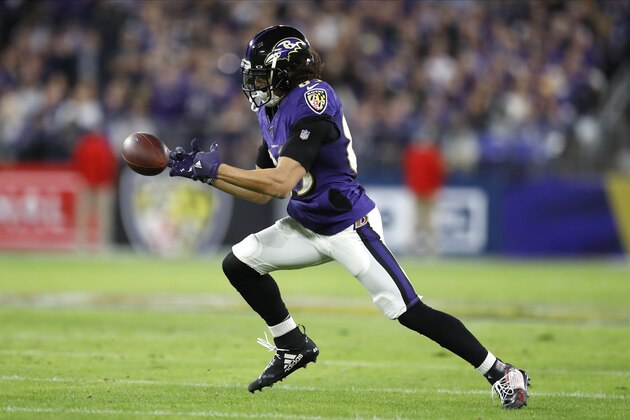 Baltimore Ravens wide receiver Willie Snead bobbles a pass before dropping it against the Tennessee Titans during the firs half of an NFL divisional playoff football game, Saturday, Jan. 11, 2020, in Baltimore. The Titans won 28-12. (AP Photo/Julio Cortez)